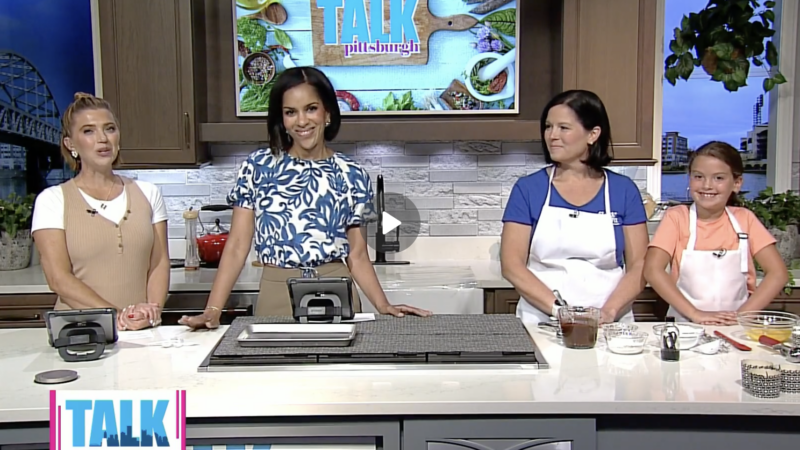 Amy Knight and her daughter Adeline demonstrate chocolate lava cakes during a CBS Pittsburgh segment highlighting Flour Power Studios Pittsburgh cooking classes.